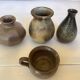Eight brown ceramic pitcher vases