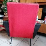 Red and black chair with brass feet