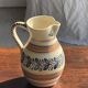 Beige carafe with stylized blue flower friezes