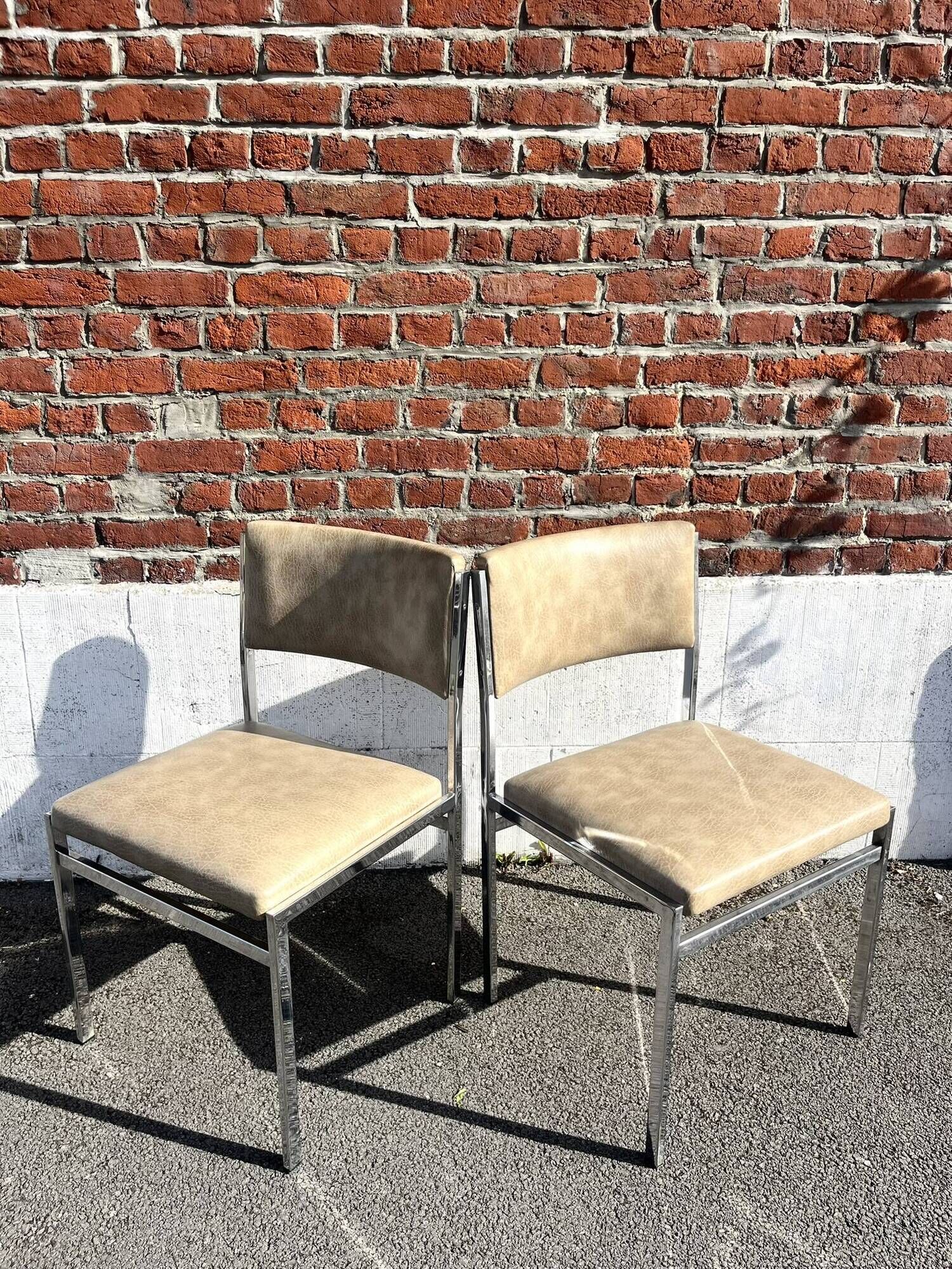 Set of 4 vintage chairs in chrome and faux leather.