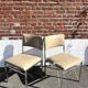 Set of 4 vintage chairs in chrome and faux leather.