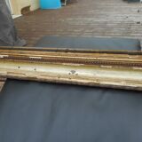 Antique mirror glass in wood and gilded stucco, late 19th century