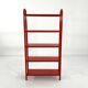 Red tubular leg shelf, 1980