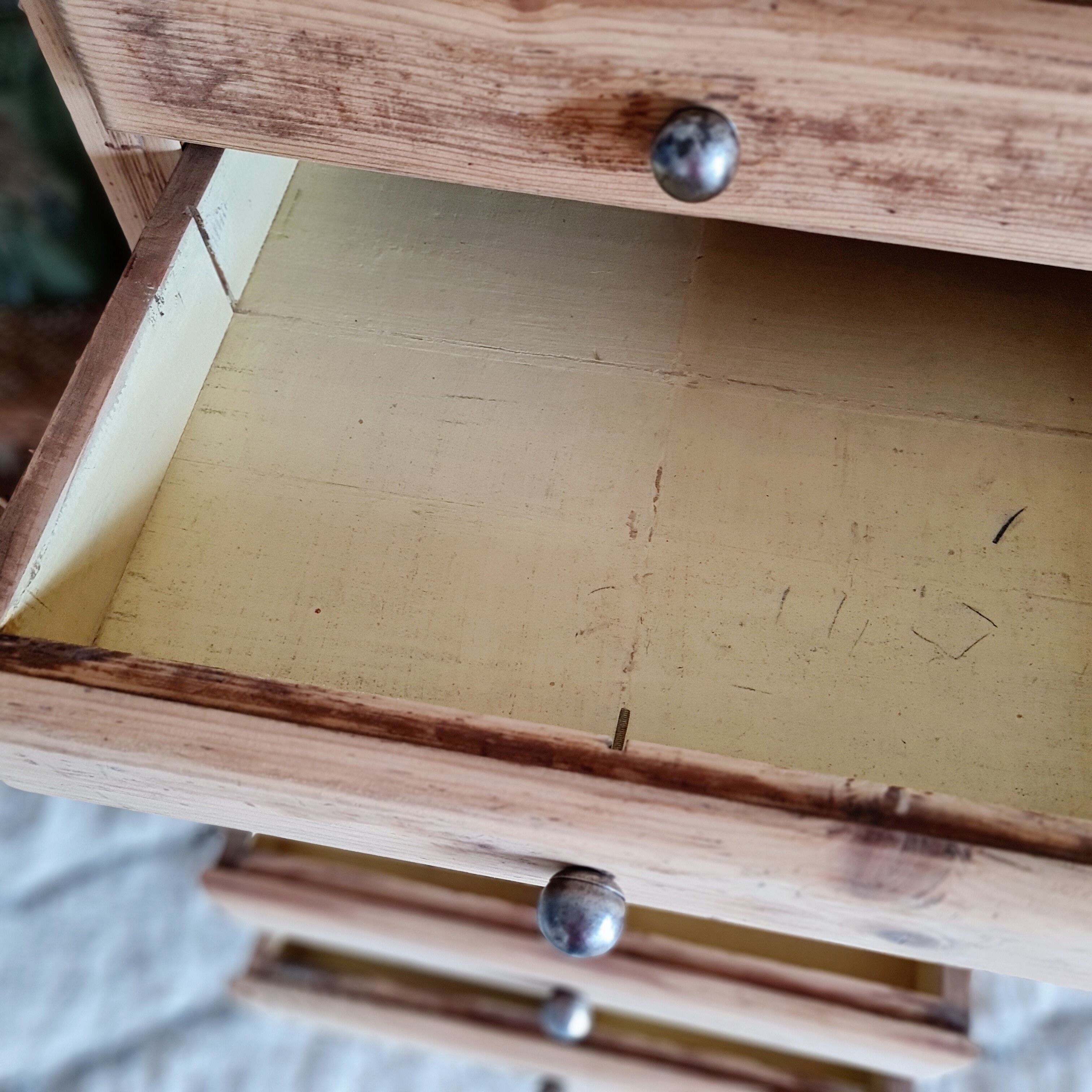 Old wooden chest of drawers raw and black wood