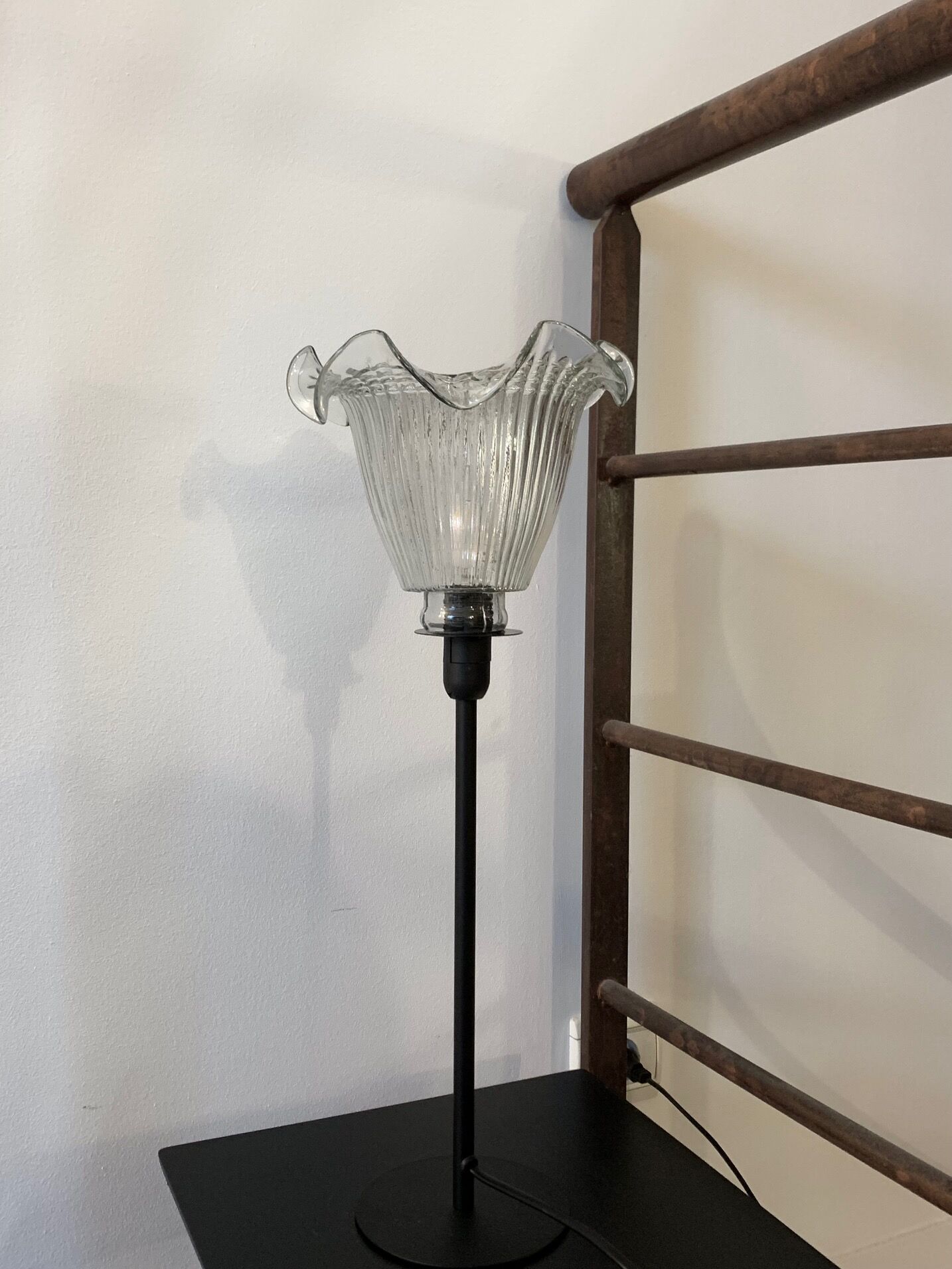 Table lamp with a vintage antique globe in ridged glass mounted on gilded stand