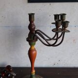 Old candlestick in painted wood and folding metal