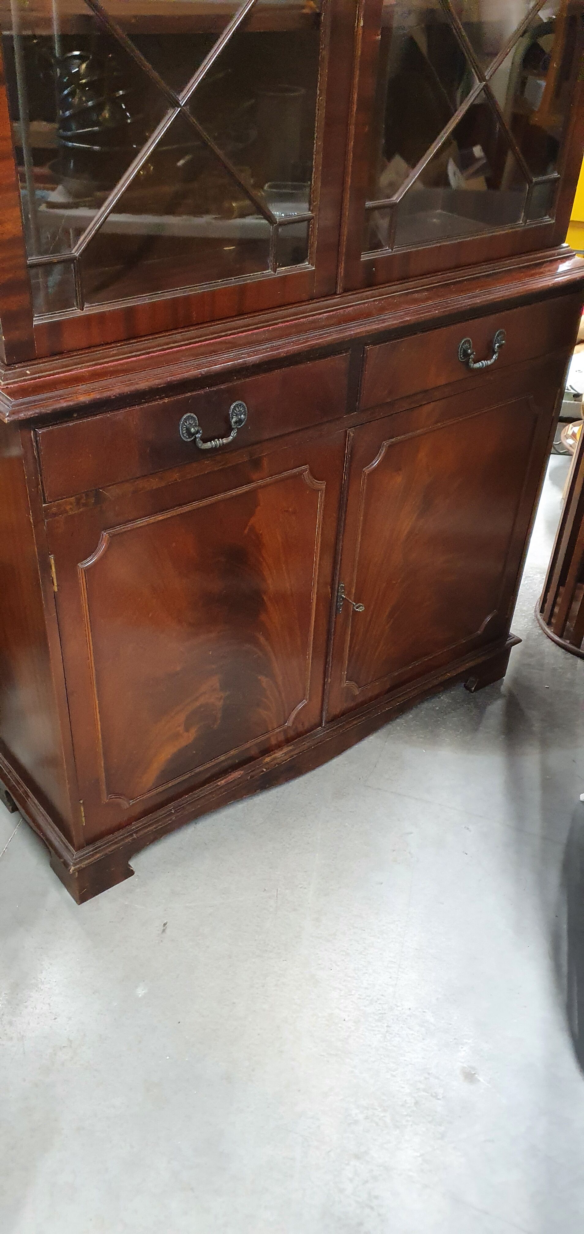English showcase, two bodies, solid mahogany an of the 50s