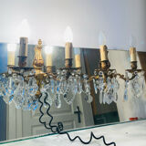 Pair of gilt bronze wall sconces with pendants from the mid-20th century.