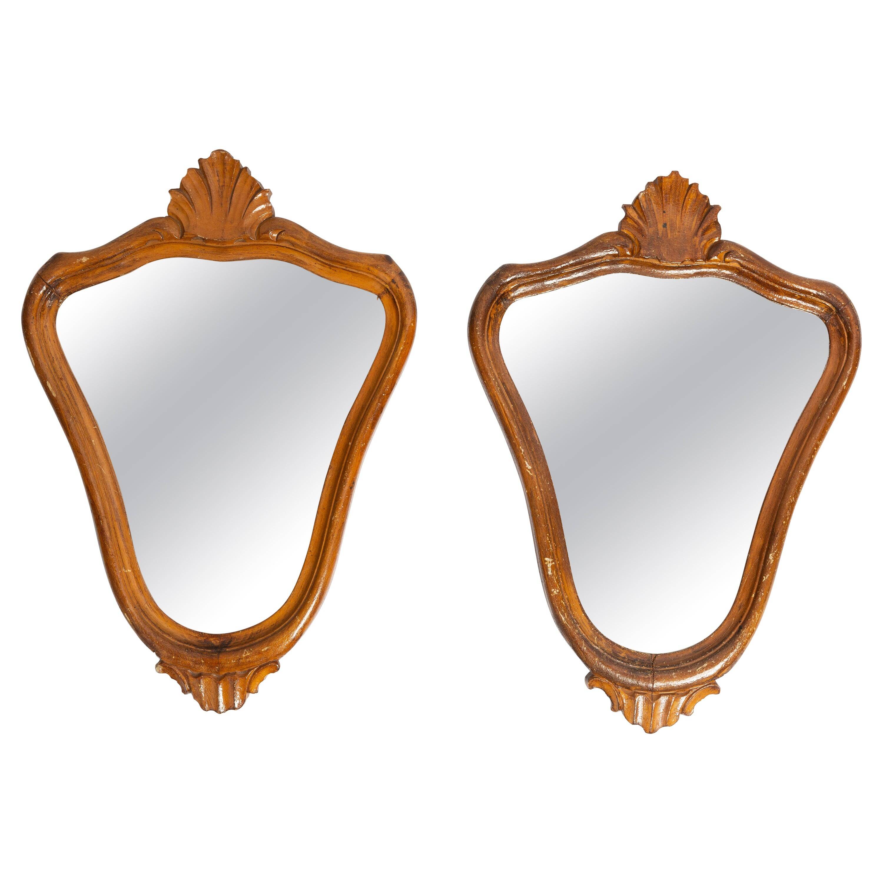 Pair of vintage Mid-Century decorative mirrors in a gold frame, Italy, 1960s.