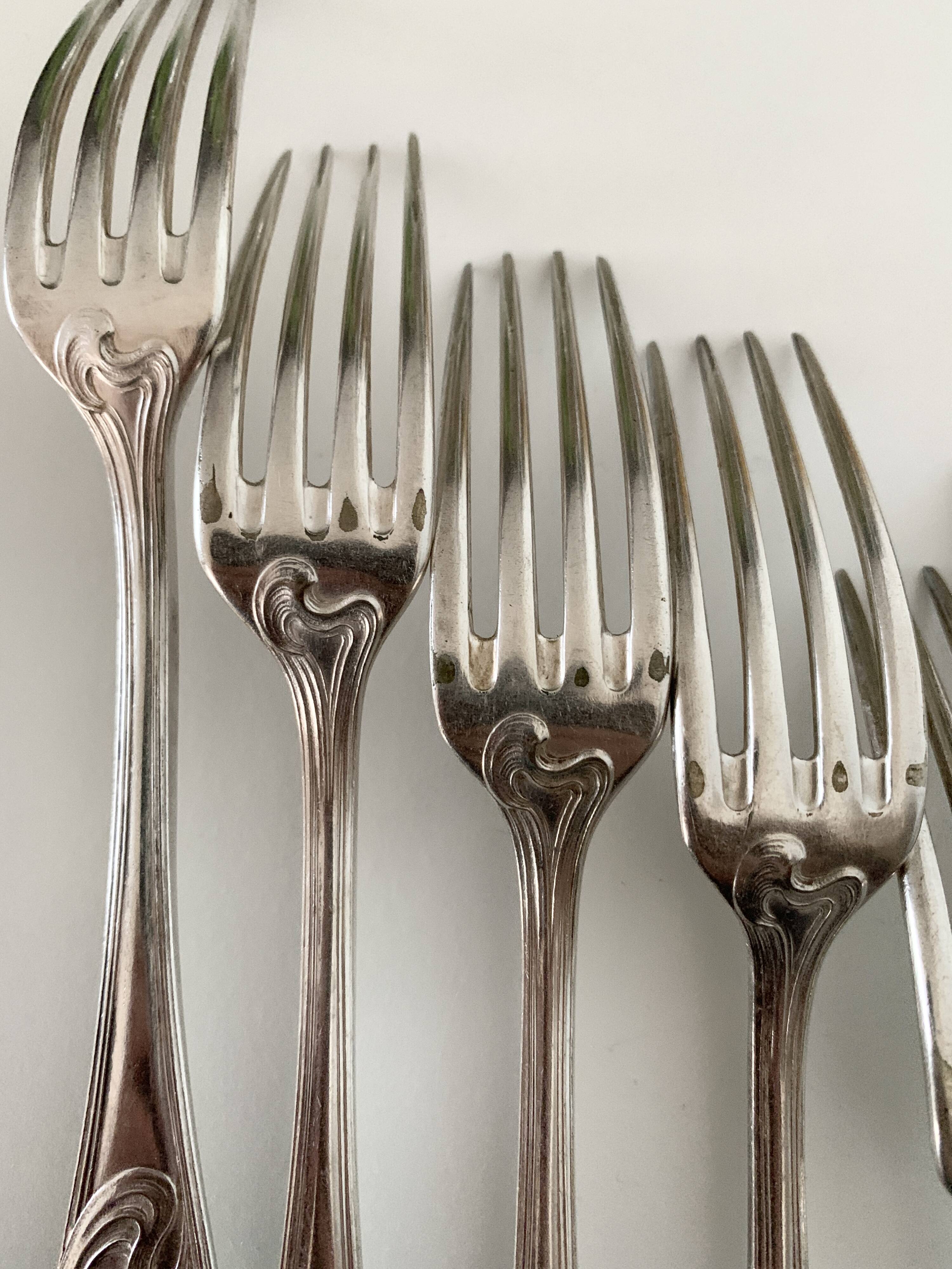 Nine large Ercuis silver-plated forks