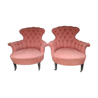 Pair of toad armchairs on wheels, upholstered.
