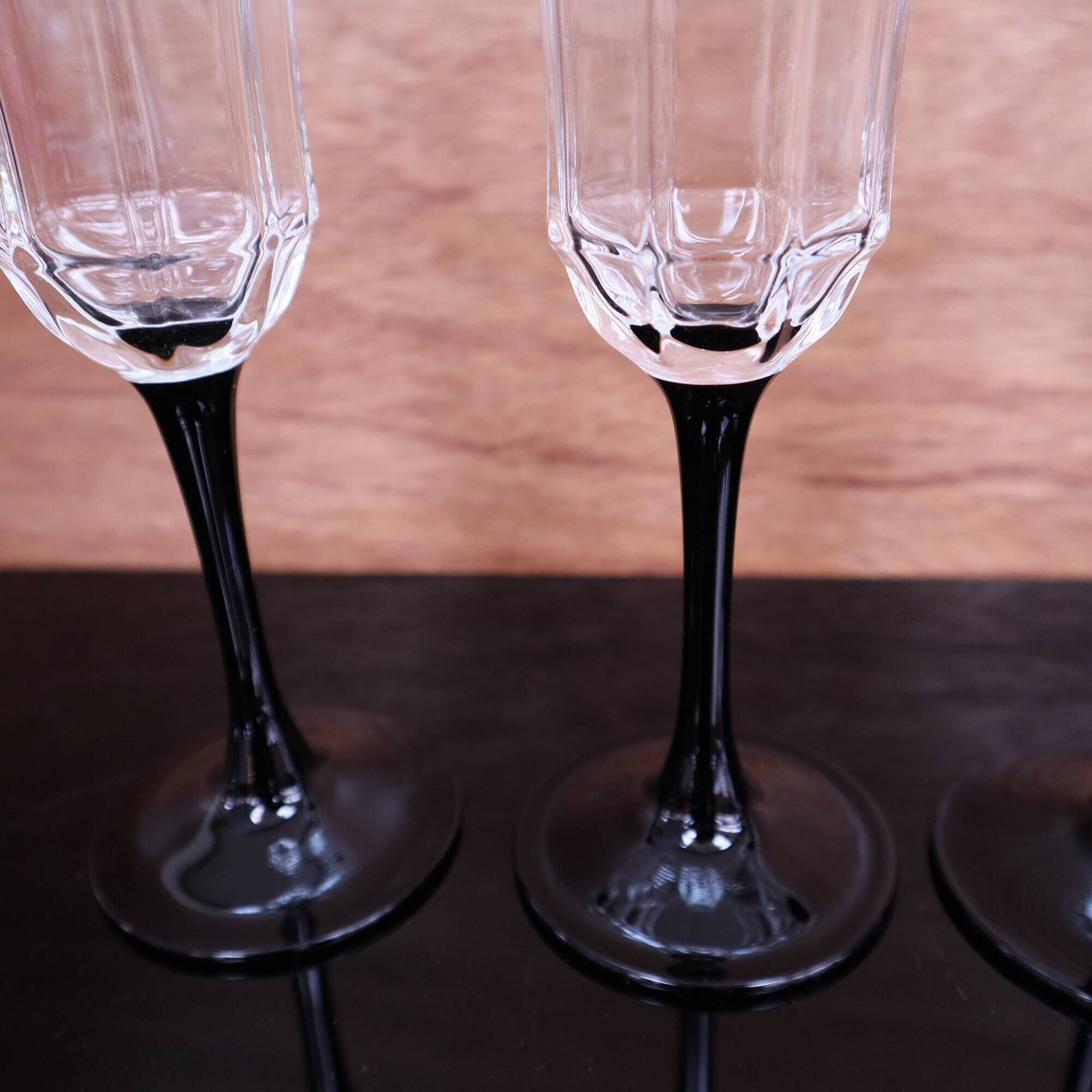 4 octagonal black base Champagne flutes Octime