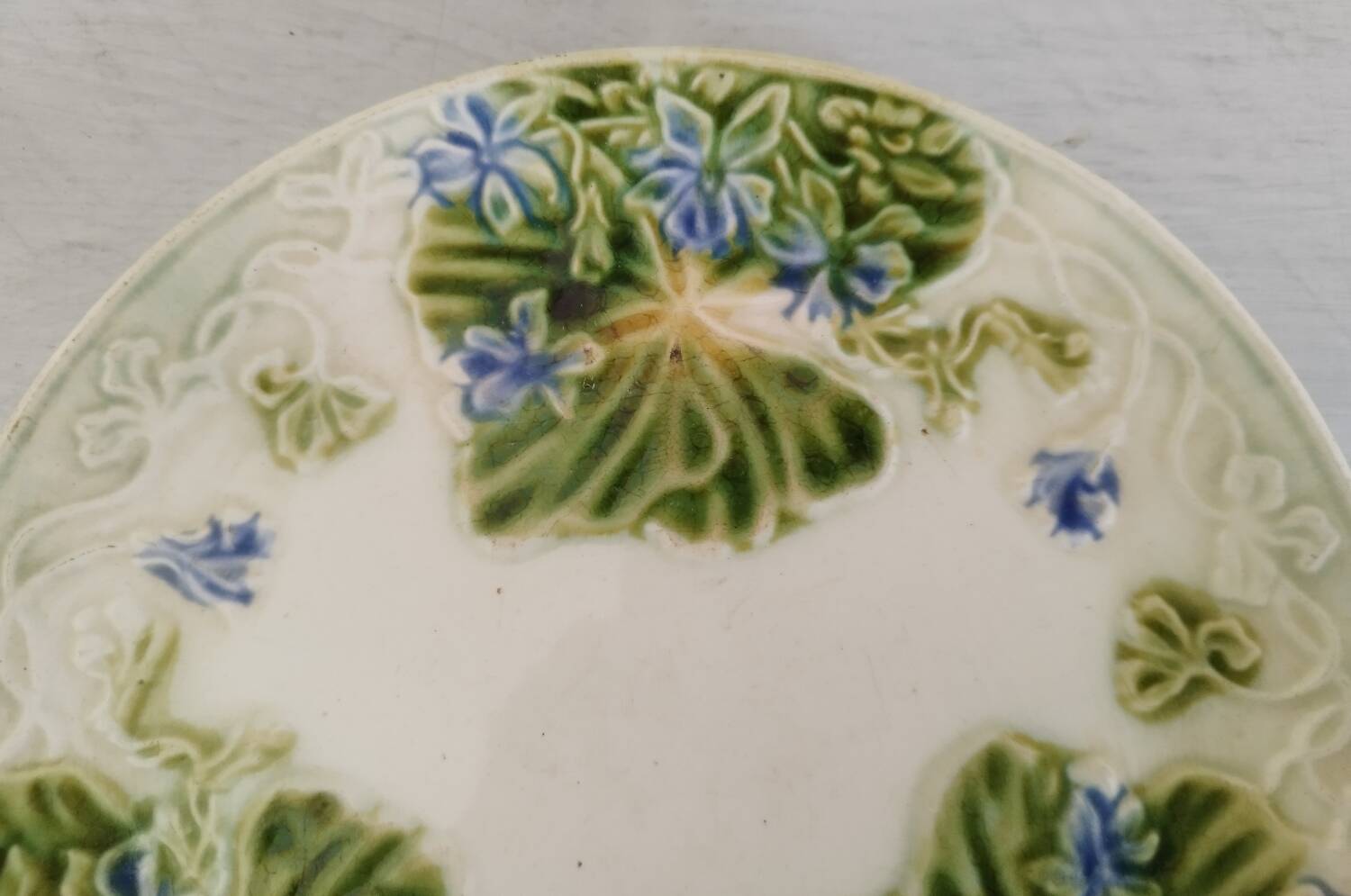 Antique Barbotine Plate Floral Decor and Green Foliage