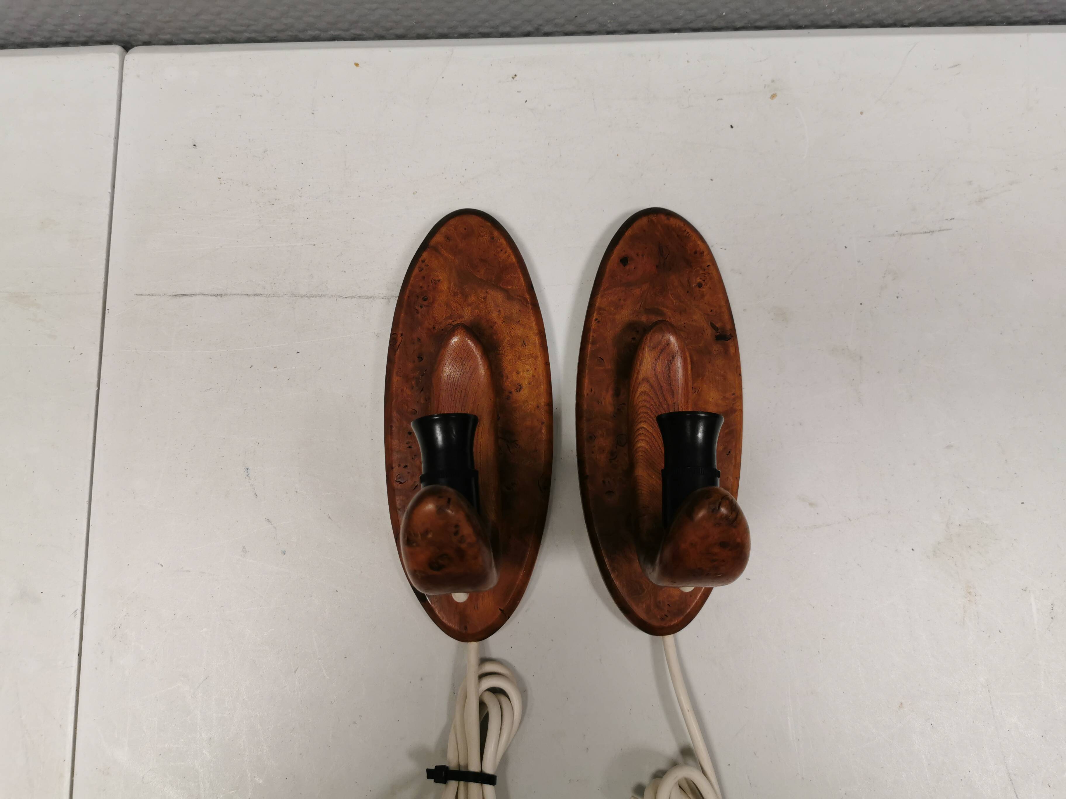 A set of old wall lamps in walnut.