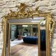 Antique mirror with a frame 123/100cm with gilded pediments, eagle heads, antique.