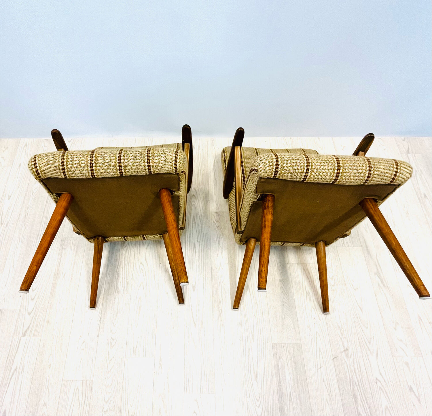A pair vintage cocktail chairs with stripes and metal screws