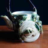 Individual teapot in the shape of a ceramic shell