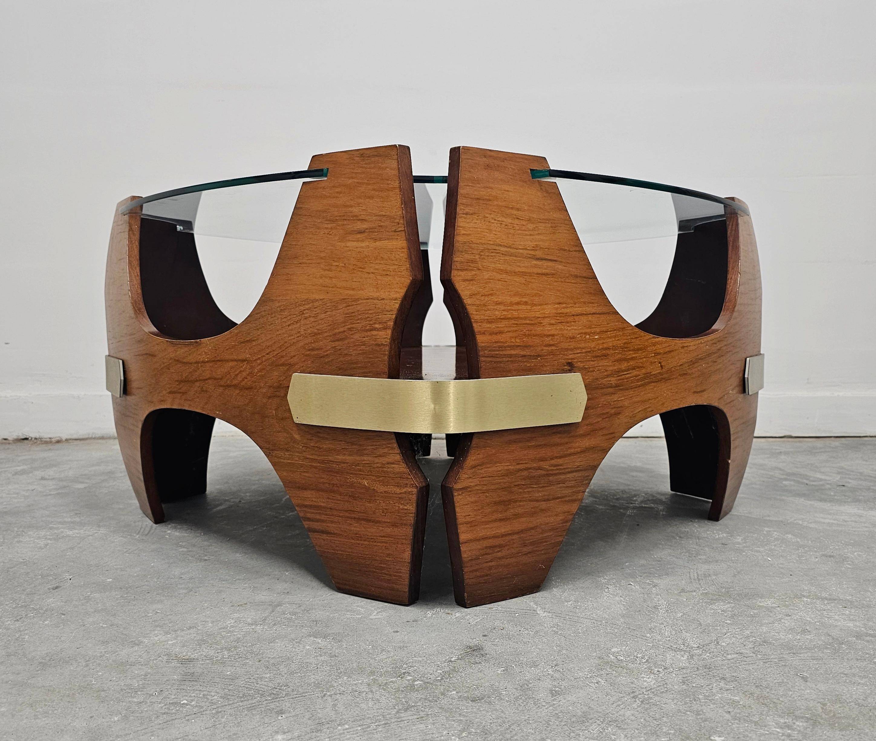 Mid-century coffee table in curved plywood with a glass top, 1940s.