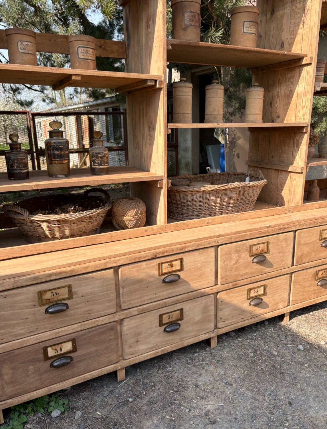 Large antique workshop furniture with drawers and shelves.