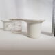 Three white porcelain and glass inkwells for school desk