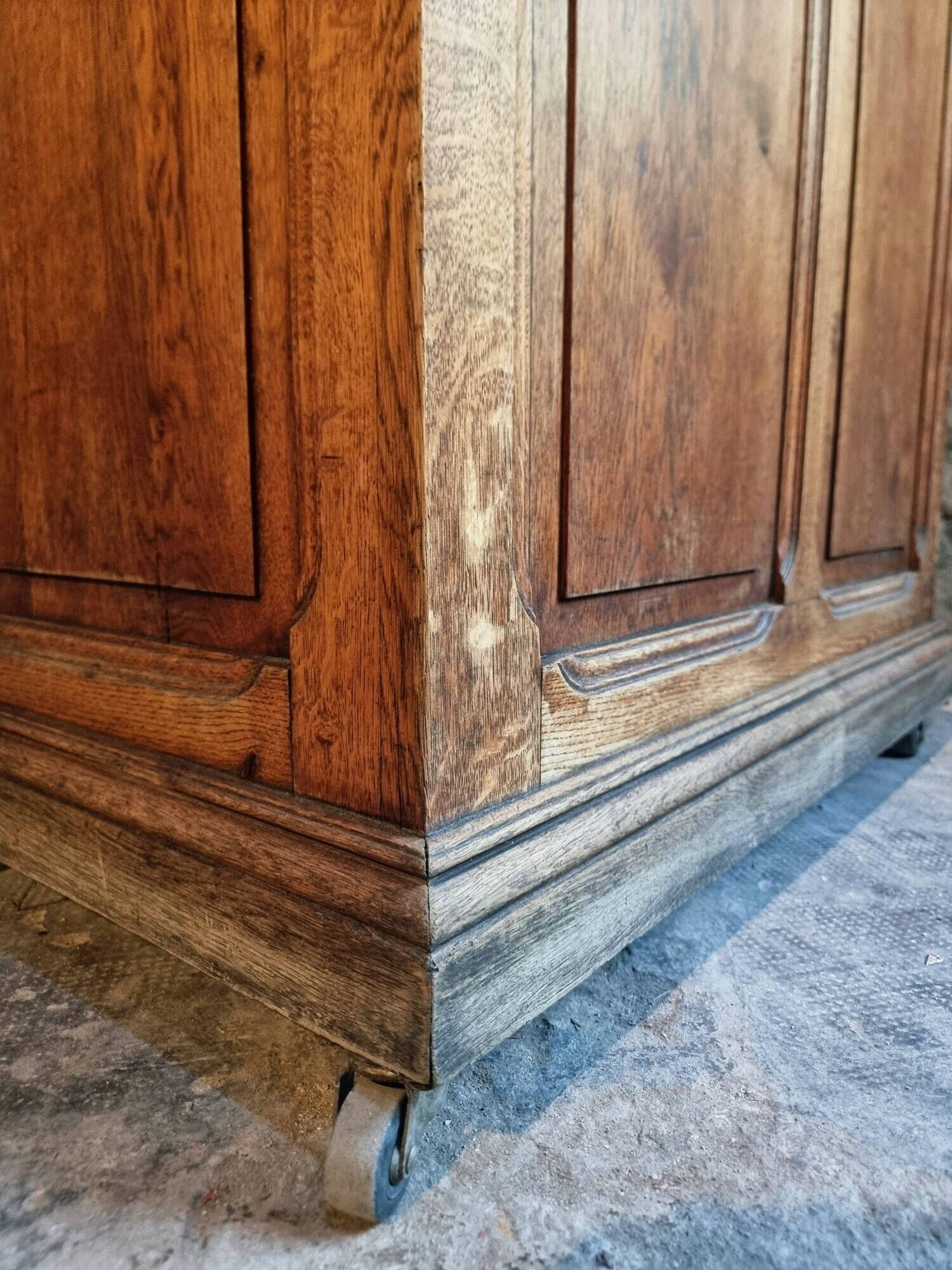 Antique French oak shop counter, kitchen island on wheels, circa 1880–1900.