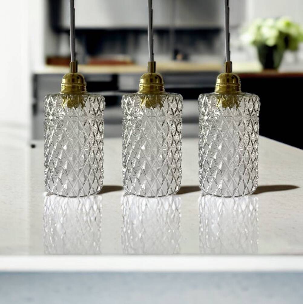 Set of three chiseled glass pendant lights of Scandinavian origin