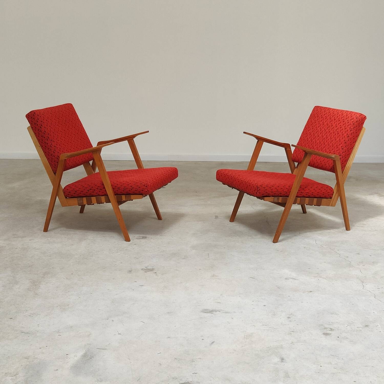 Pair of armchairs in mottled red and wood by Uluv, former Czechoslovakia 1960