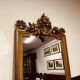 Antique English golden barock mirror mirror with large ornament
