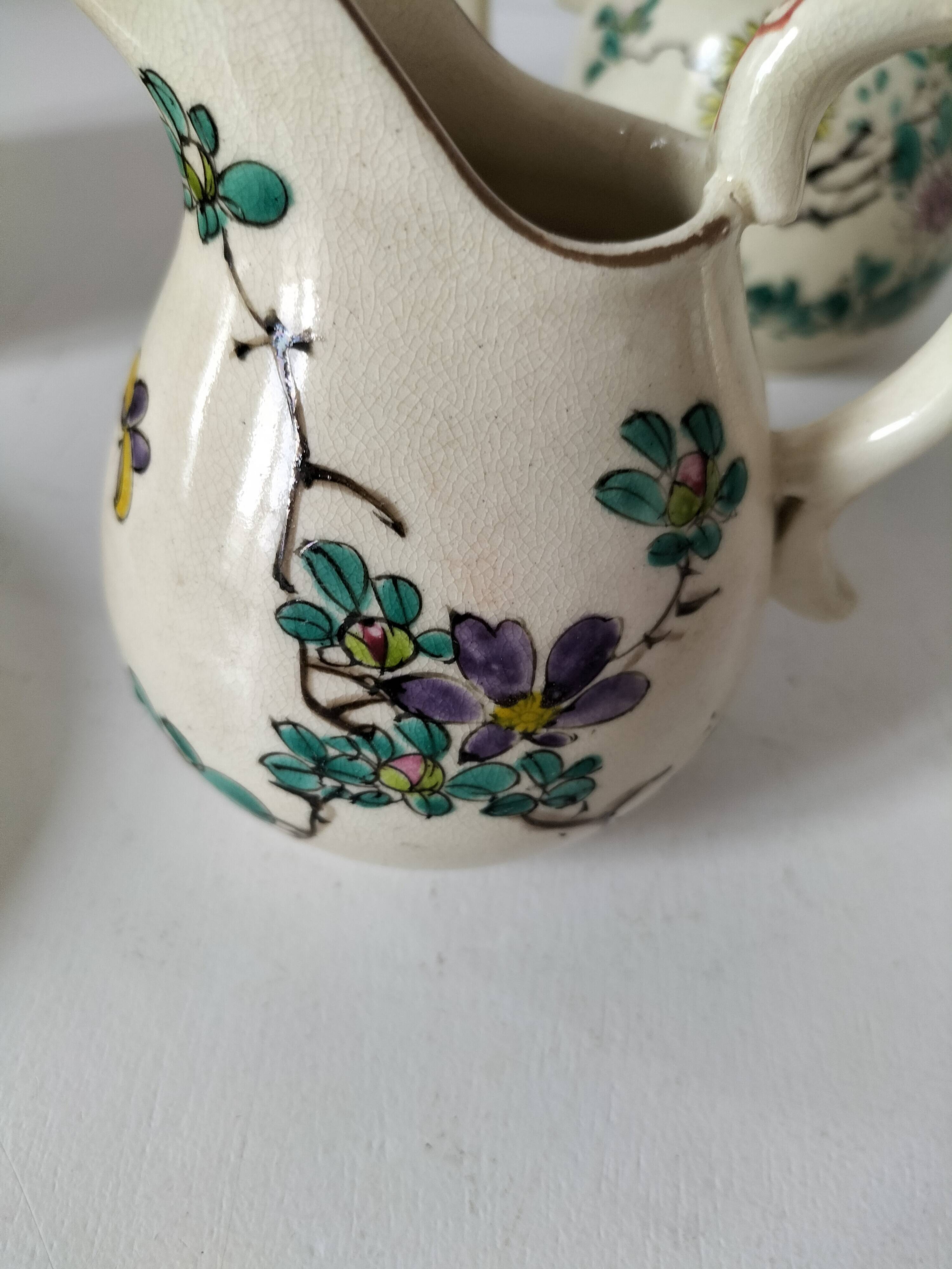 Japanese-style tea set in cracked earthenware with chrysanthemum flowers