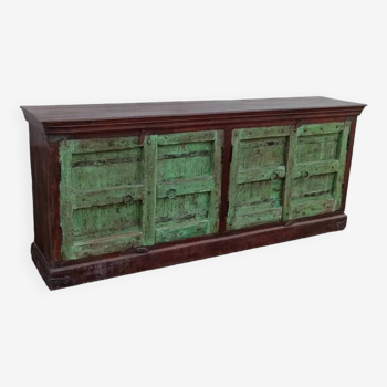 Long wooden sideboard with old green doors
