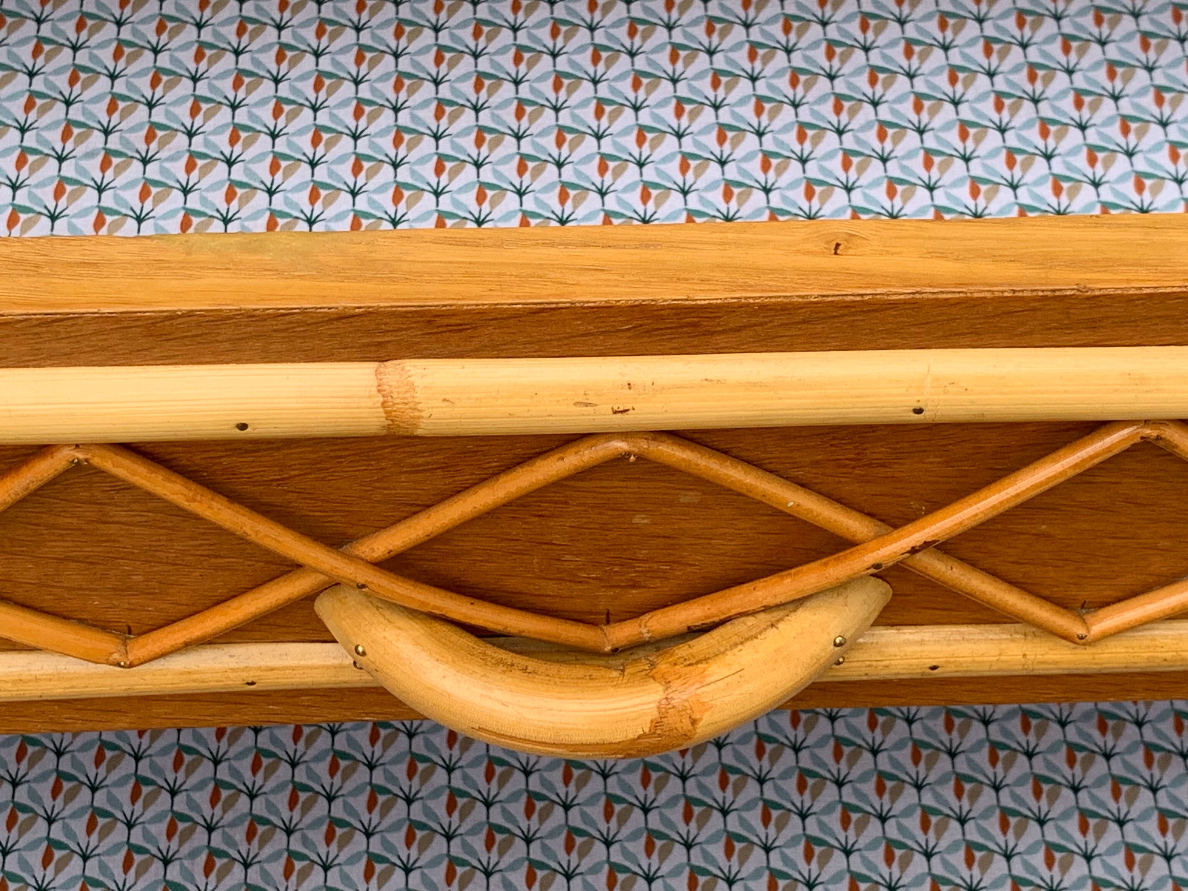 Rattan wardrobe with tapered legs from the 1960s.