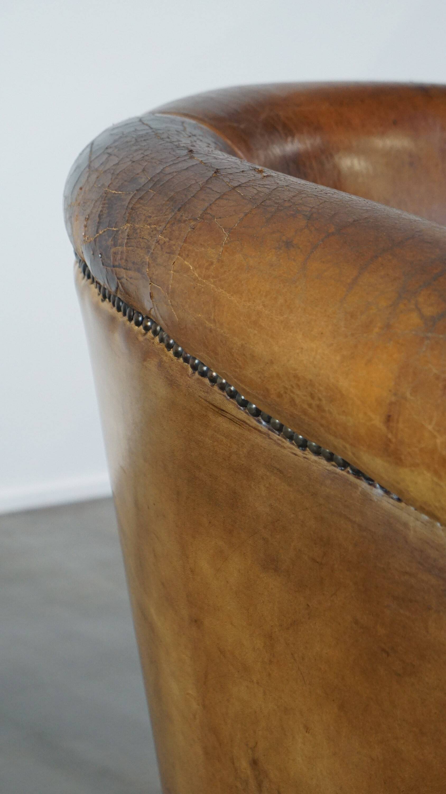 Sturdy, stately and subtle vintage sheepskin club chair
