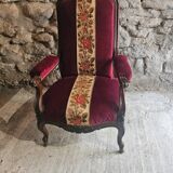 Louis-Philippe armchair in mahogany and burgundy velvet, floral decoration.