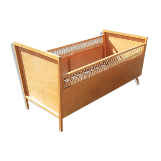 Rattan bed and vintage baby wood