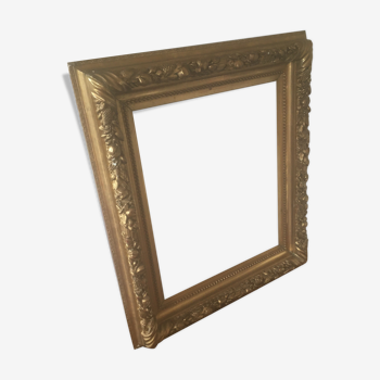 Gilded stucco frame patterned with fruit and foliage patterns