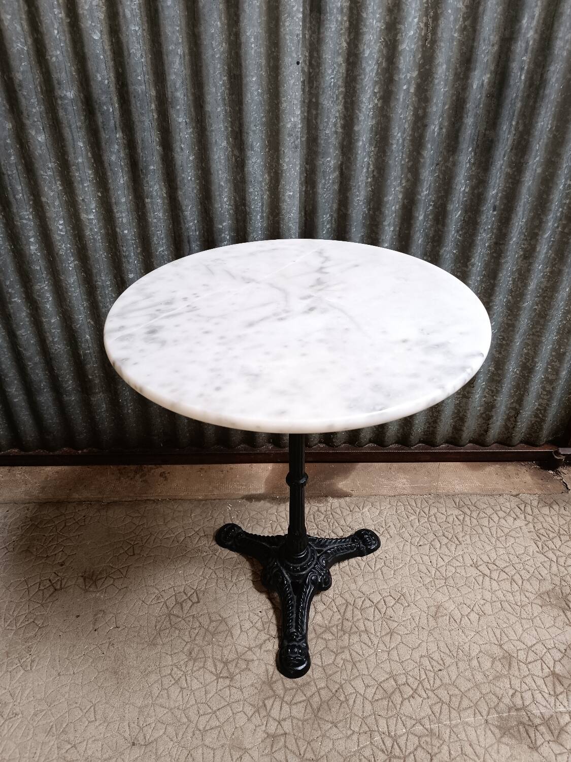 Round marble bistro table with cast iron legs