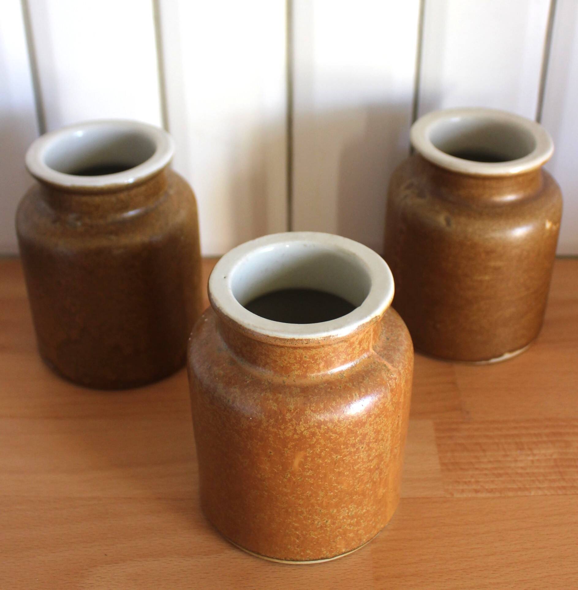 A set of 3 vintage glazed stoneware vases for indoor use.