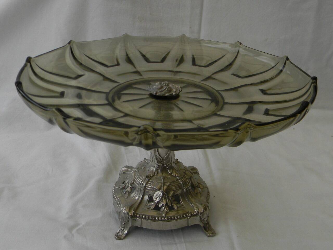 Large smoked glass fruit bowl with a metal base.
