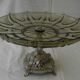 Large smoked glass fruit bowl with a metal base.