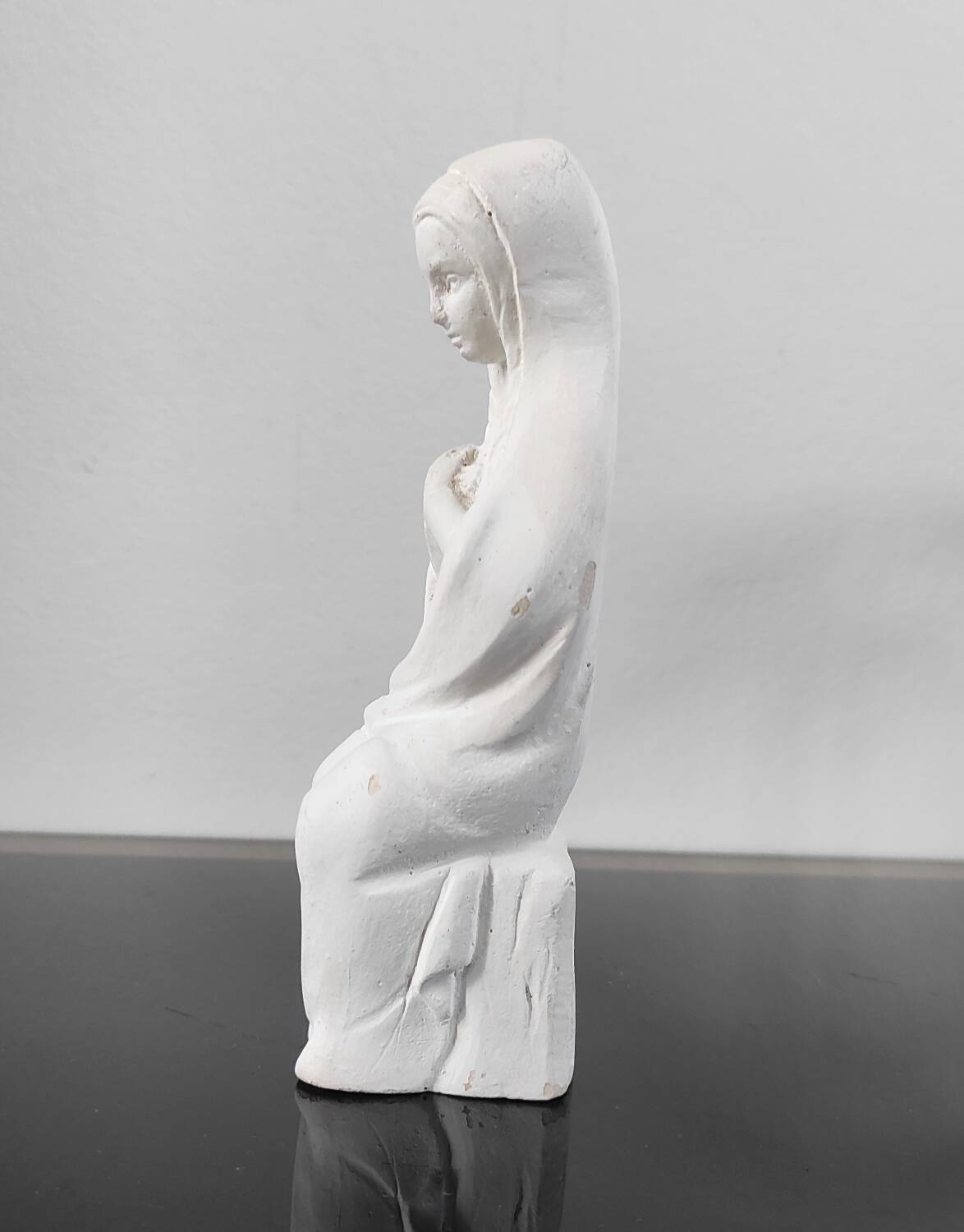 Vintage white plaster statuette of the Virgin Mary.