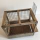 Old bird cage in wood and steel