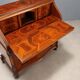 Antique drop-leaf table in walnut with maple inlays, Italy, 20th century.