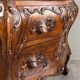 Curved commode in the Louis XV style, carved wood, 19th century.