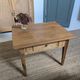 Small antique wooden coffee table with drawer, country style.
