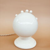 Hand-operated wall lamp in opaline globe ceramic
