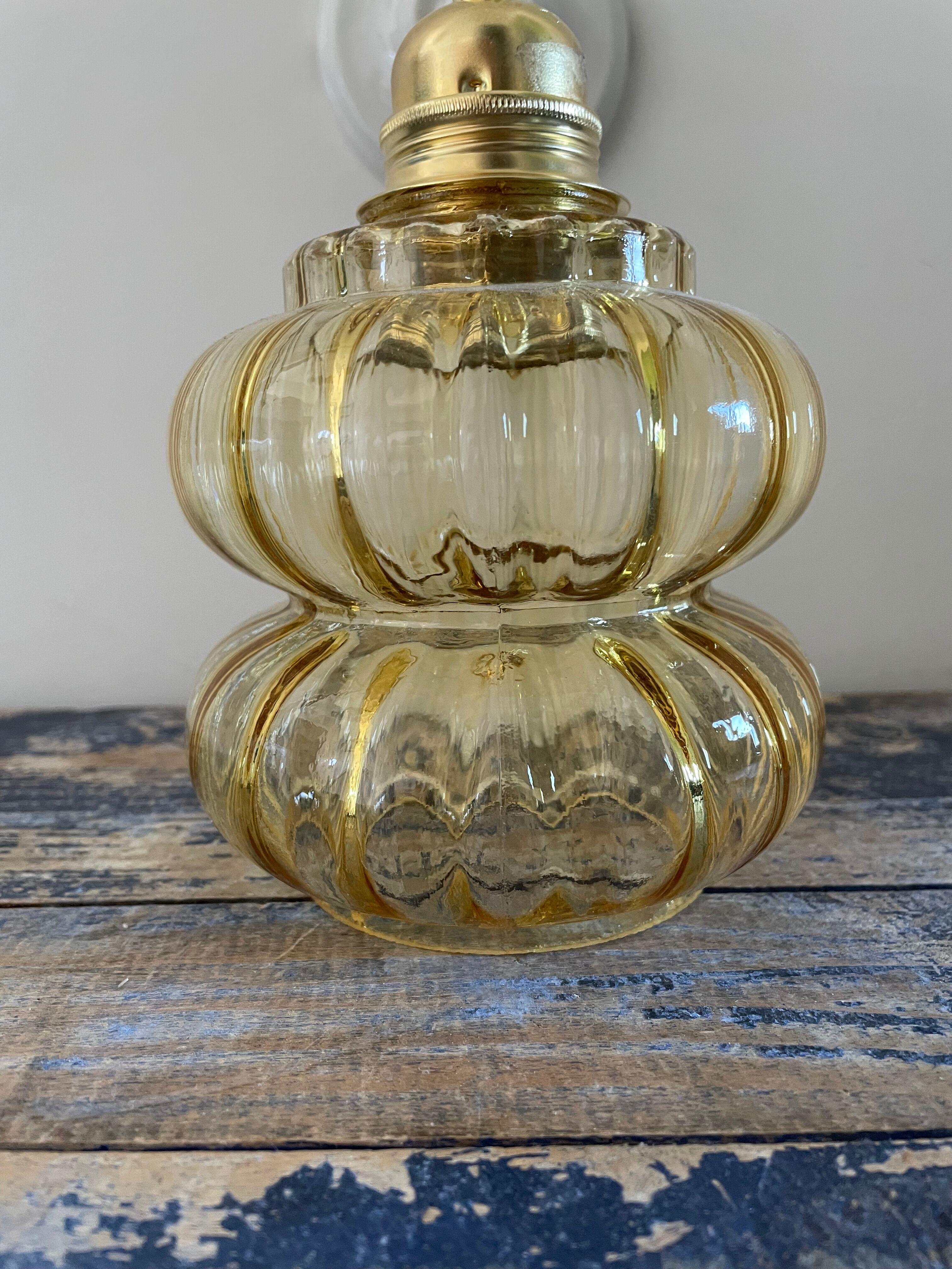 Vintage wall lamp in gilded chiseled glass
