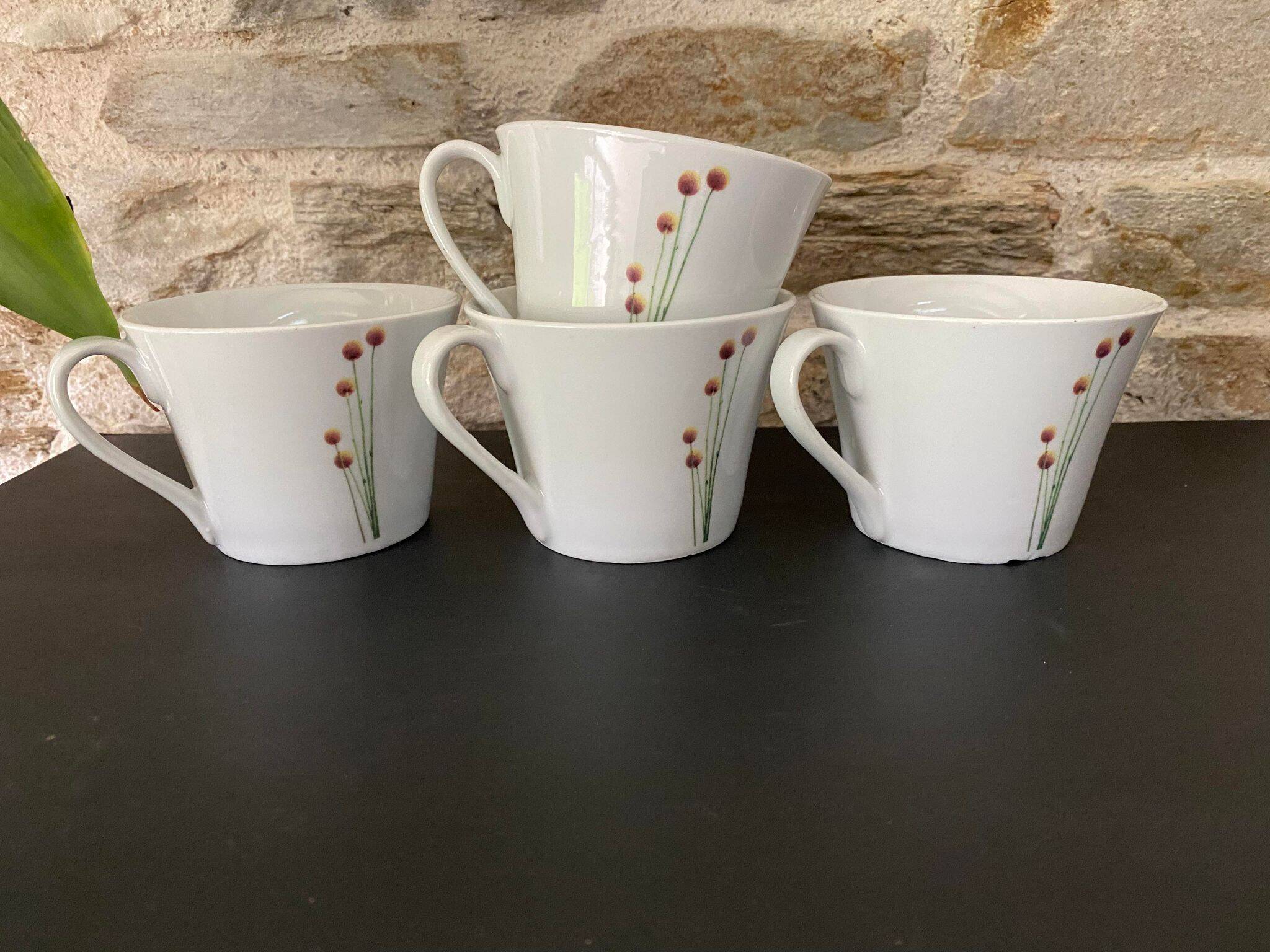 4 fine white porcelain cups with fine flower decoration
