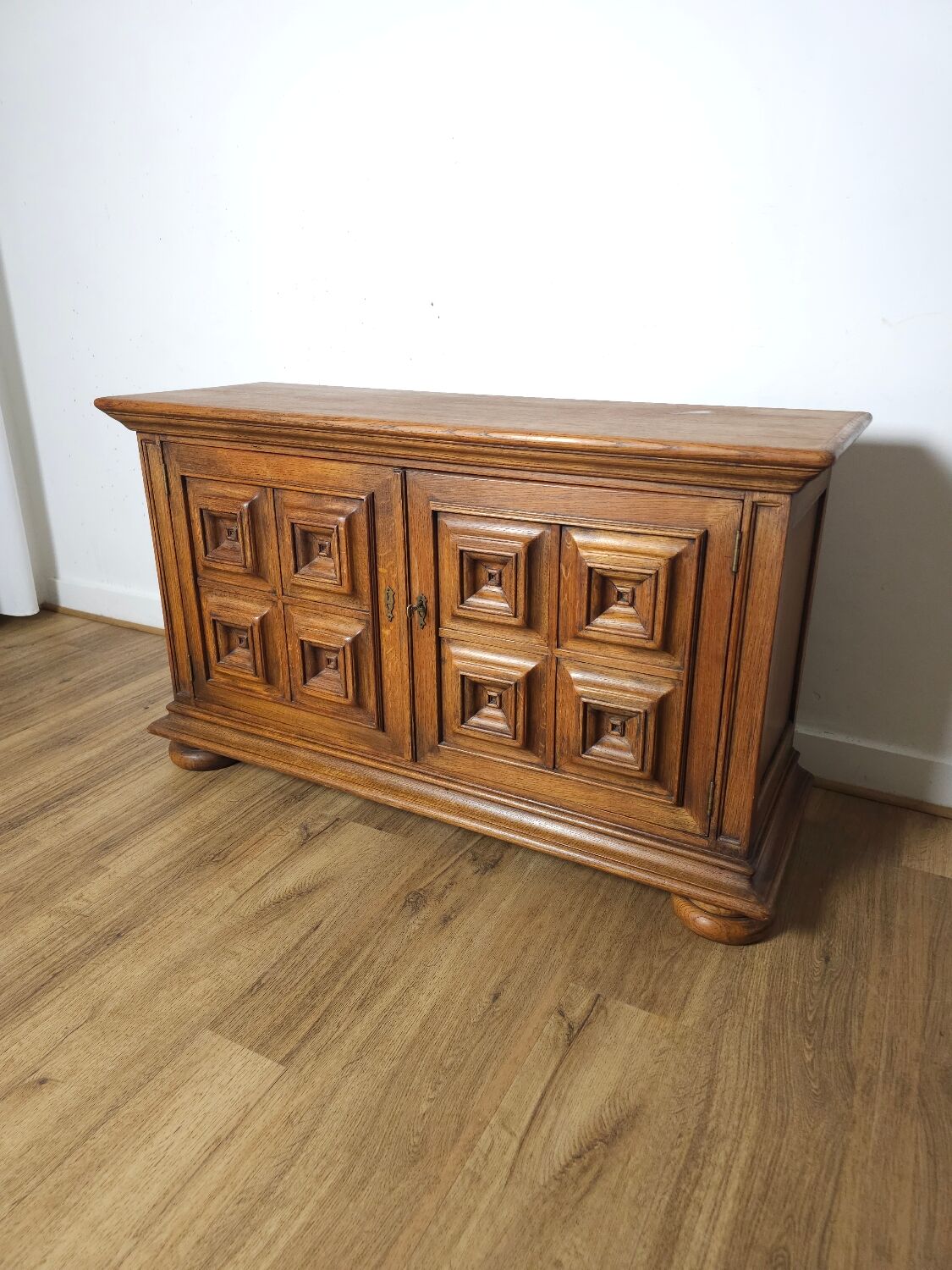 Small two-door oak sideboard, geometric design, mid-century.