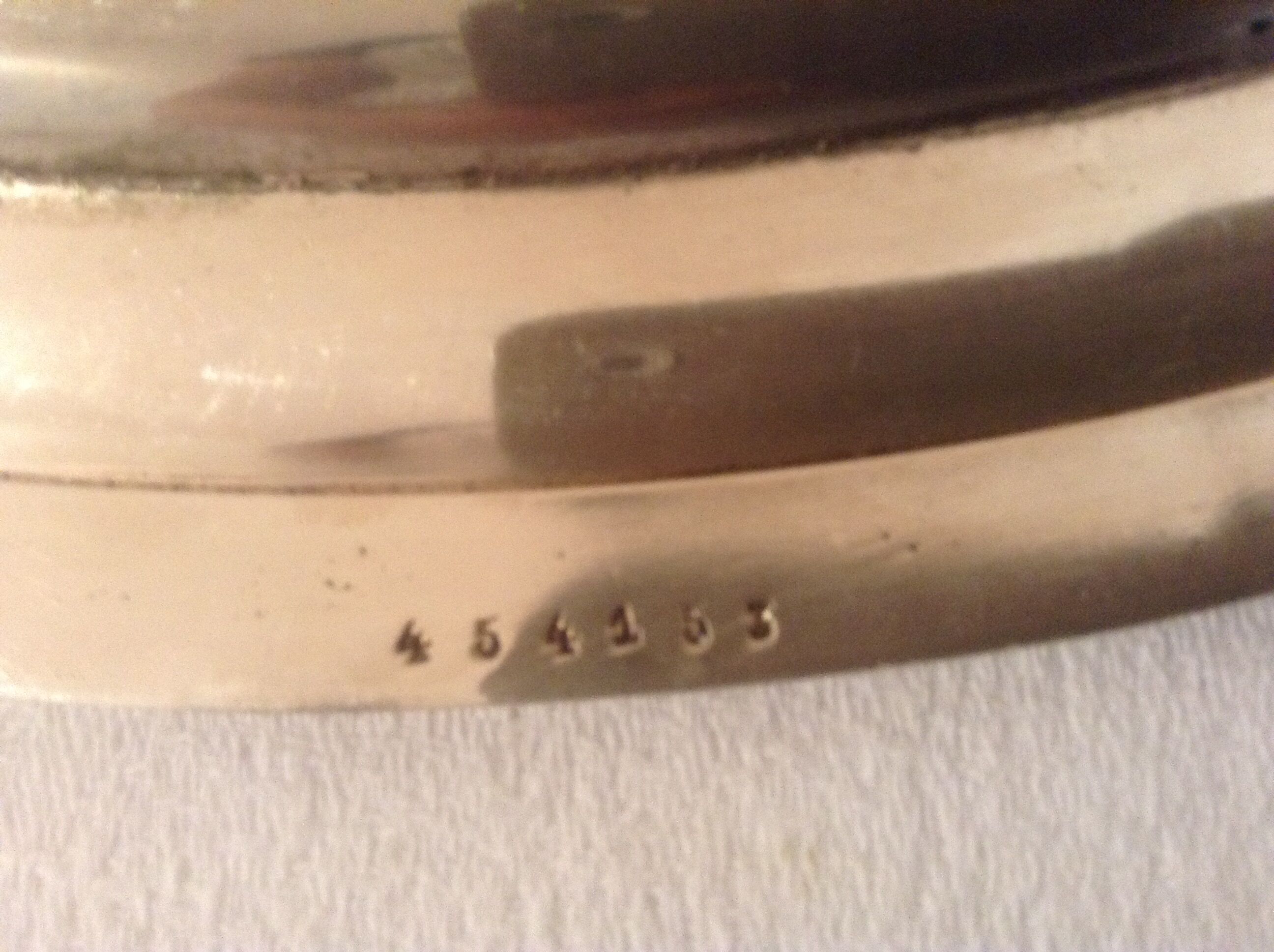 Flat oval silver metal