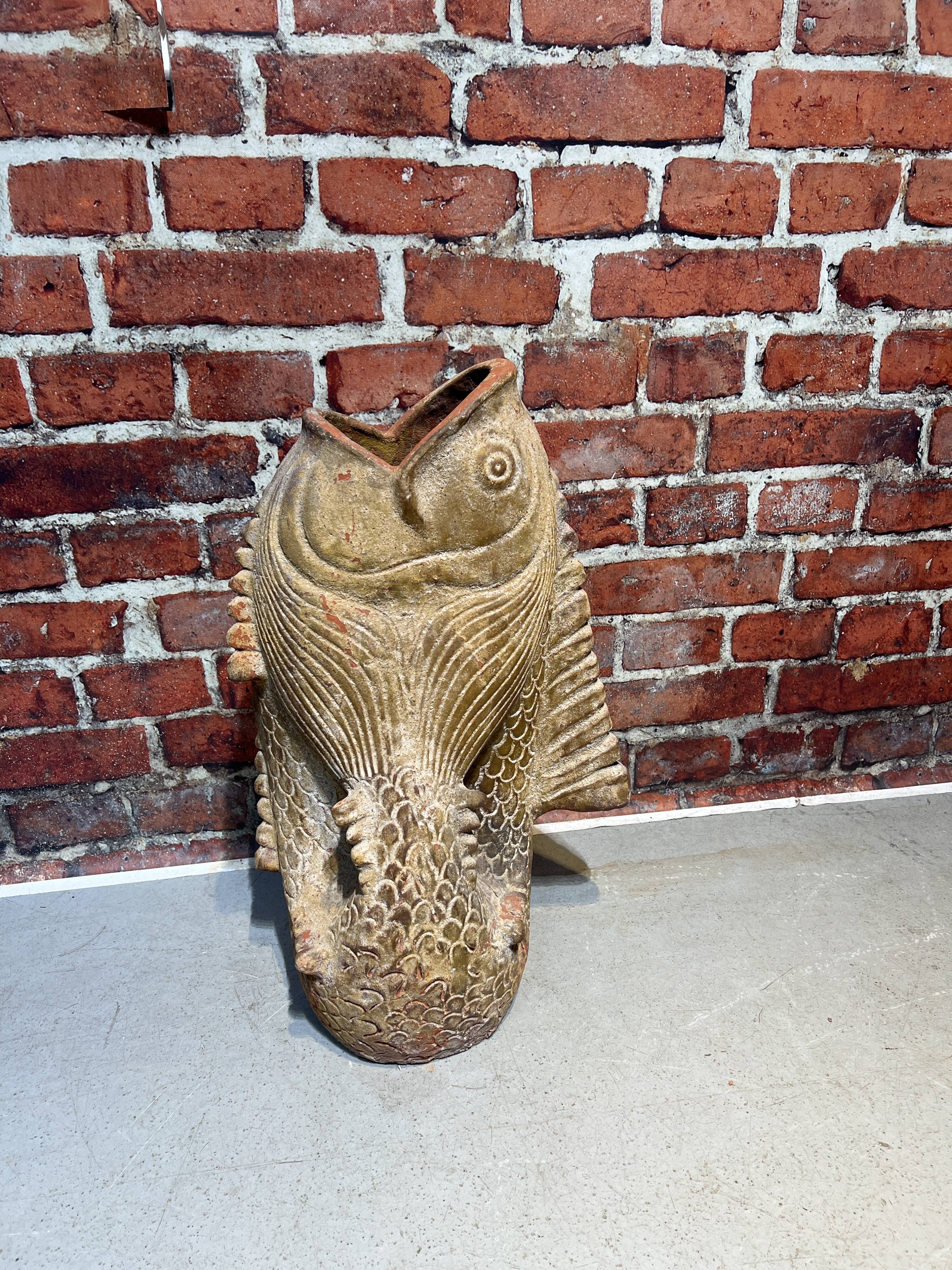 Terracotta umbrella stand in the shape of a fish
